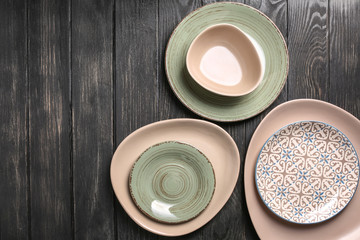Set of clean color plates on table