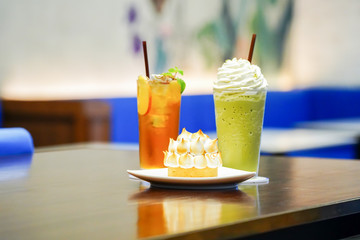 Sweet and beverate; Ice lemen tea and ice milk green tea with crown pie cake