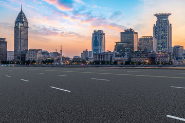 Obraz premium City skyscrapers and road asphalt pavement