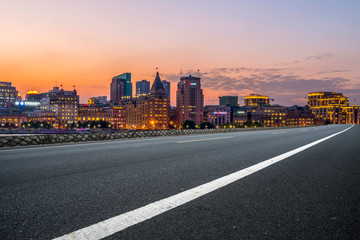 City skyscrapers and road asphalt pavement