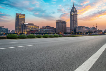 Naklejka premium City skyscrapers and road asphalt pavement