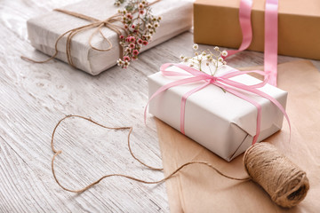 Beautiful gift boxes with threads on light table
