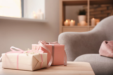 Beautiful gift boxes on wooden table