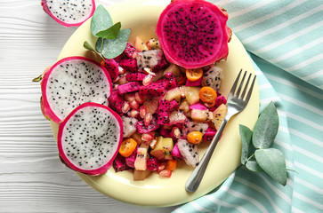 Salad with tasty dragon fruit on plate