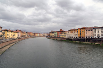 Obraz premium PISA, ITALY - OCTOBER 29, 2018: View of the medieval town of Pisa from bridge 