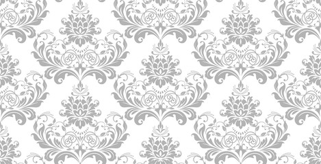 Wallpaper in the style of Baroque. Seamless vector background. White and grey floral ornament. Graphic pattern for fabric, wallpaper, packaging. Ornate Damask flower ornament.