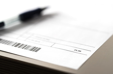 Electricity, energy, utilities or phone bill on table. Paper invoice and pen on table. Cost of...