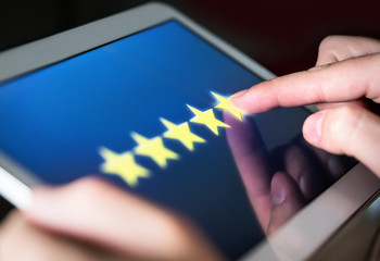 5 star rating or review in survey, poll, questionnaire or customer satisfaction research. Happy man...
