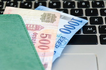 Banknotes on a black keyboard