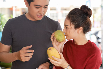 Couple choosing mango