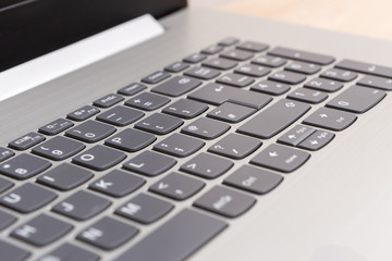 Laptop keyboard selective focus.
