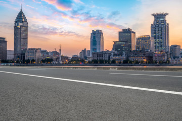 Fototapeta premium City skyscrapers and road asphalt pavement