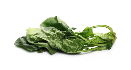 Fresh spinach leaves isolated on white background