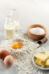 Ingredients for dough and pastry on wooden table