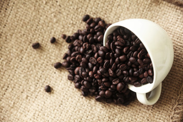 Hot espresso coffee cup and coffee beans.