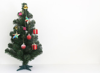 christmas tree with decorations ball and box gift on white background