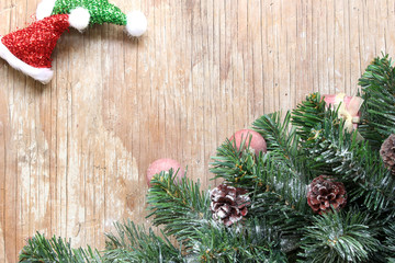 christmas tree background with decorations on wooden board