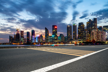 City skyscrapers and road asphalt pavement