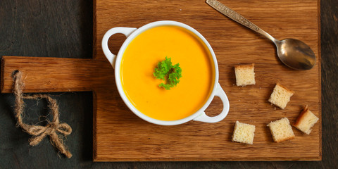 pumpkin soup (orange sweet potatoes). Healthy food. Copy space. Top view