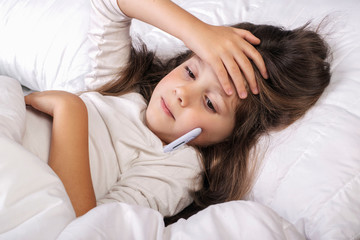 Obraz na płótnie Canvas Cold girl lying in bed