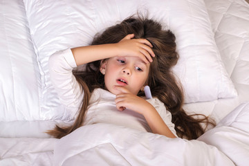 Obraz na płótnie Canvas Cold girl lying in bed