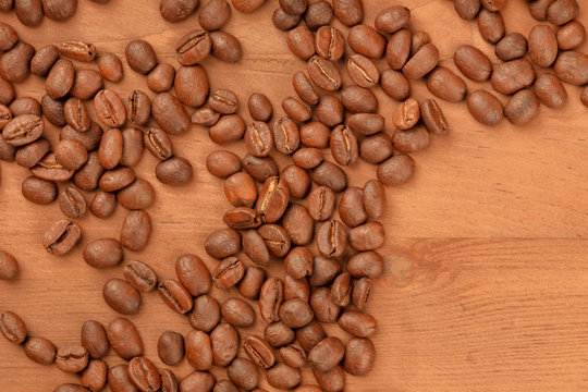 An overhead photo of coffee beans with a place for text, toned image