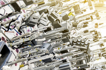 Metal rods on an inclined stand for the production of sets of electrical wiring for the automotive industry. Modern industrial plant.