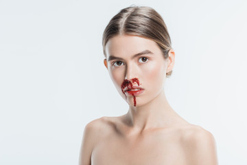 naked woman with blood and injury on face isolated on white