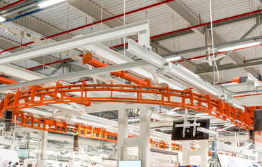 Conveyor for parts in an industrial enterprise. Modern equipment for winding electrical wires. Employment, work at the plant.