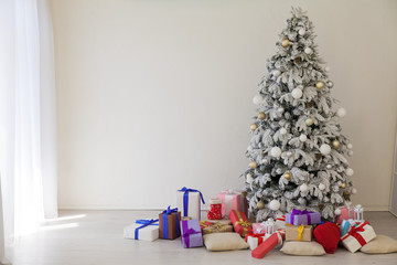 Christmas tree with presents, lights new year winter holidays