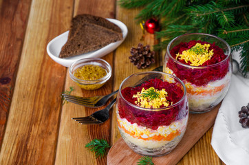 Traditional Russian salad herring under a fur coat in a glass for New Year and Christmas