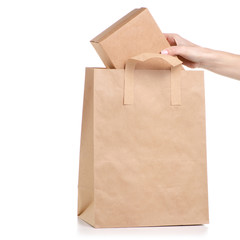 Paper bag package box in hand on white background isolation