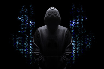 silhouette of a man in a hood with wings from a binary code, concept angelic good hacker