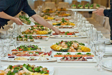delicious dishes on the table in the restaurant. serving table.