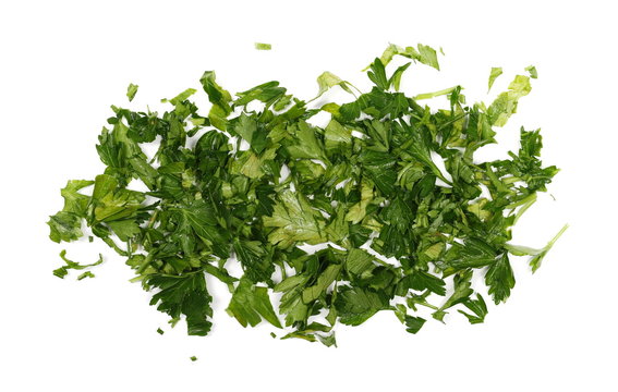 Fresh sliced up green parsley leaves isolated on white background, top view 