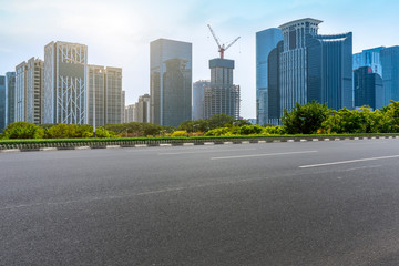 City skyscrapers and road asphalt pavement