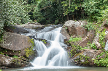 Waterfall flowing from the mountains at Phu SOI DAO waterfall in Loei ,Thailand.