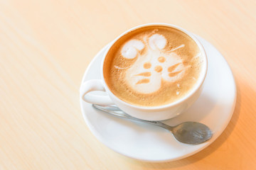 a cup of hot coffee on the wood table 
