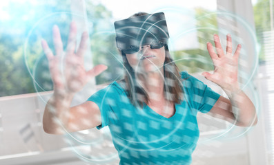 Fototapeta na wymiar Woman using a virtual reality headset, light effect