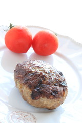 Homemade hamburger steak on white dish