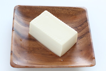 Asian food ingredient, tofu on wooden plate