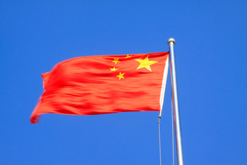 Chinese national flag with blue sky as background