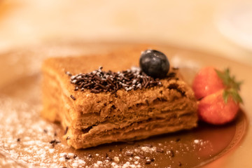 Honey cake with strawberry. Close up. Delicious dessert