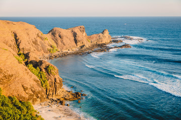 Fototapeta premium Rocky cape and blue ocean with waves in Australia