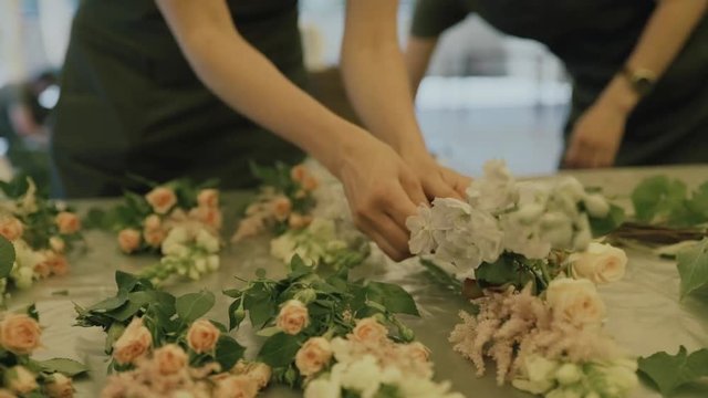 Florist create flower compositionюdecorated place for wedding ceremony.