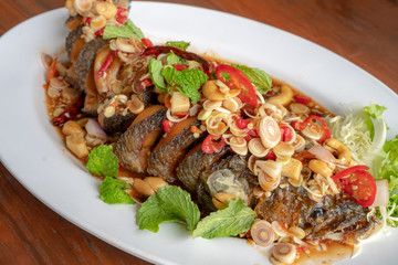 Thai Food,Snakehead fish. on a white plate