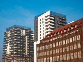 Fototapeta premium Old and new buildings next to each other.