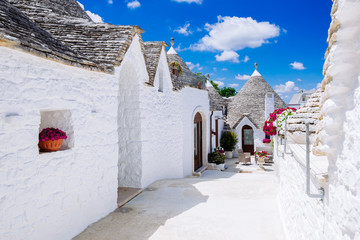 Alberobello's famous Trulli, the characteristic cone-roofed houses of the Itria Valley, Apulia, Southern Italy. - obrazy, fototapety, plakaty