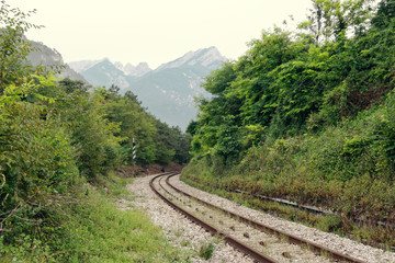 Obraz premium winding railway in summer in the mountains.