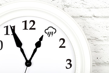 Weather forecast concept with clock showing the weather